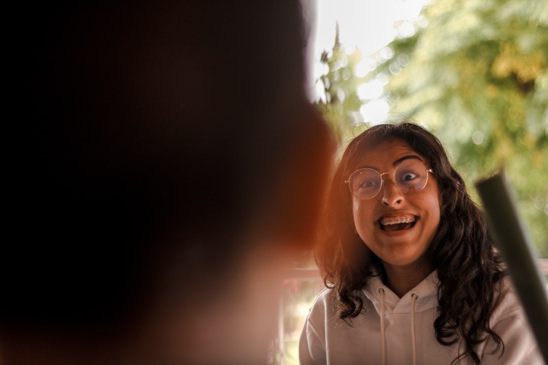 woman smiling in conversation