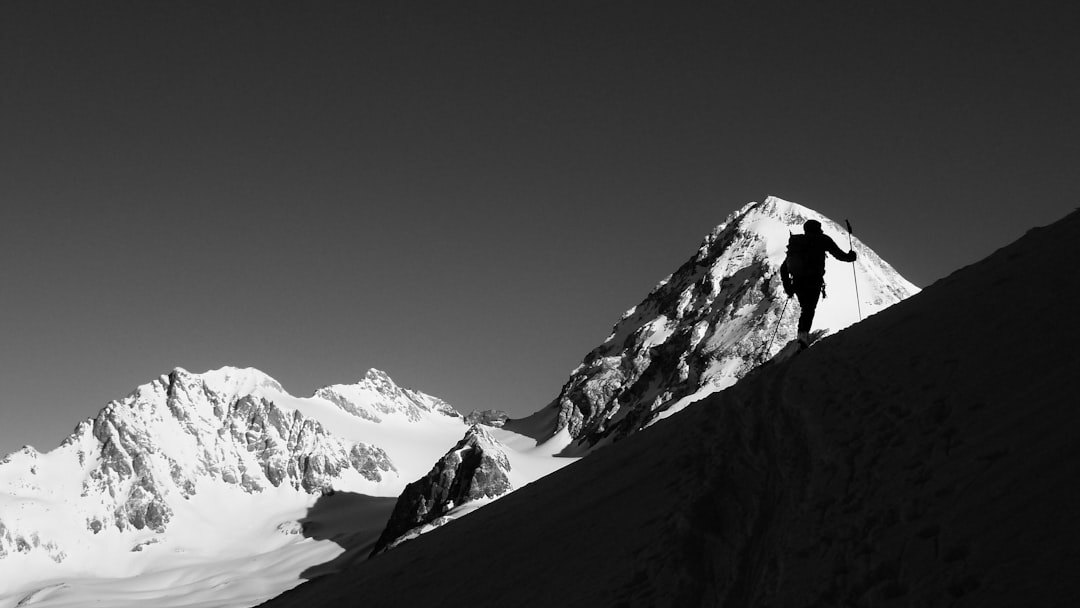 person climbing mountain